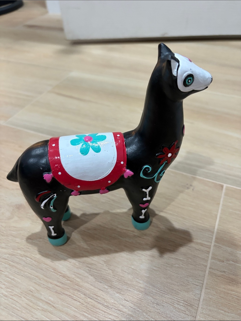 Hand-Painted Black Ceramic Llama Accent with Colorful Floral Saddle